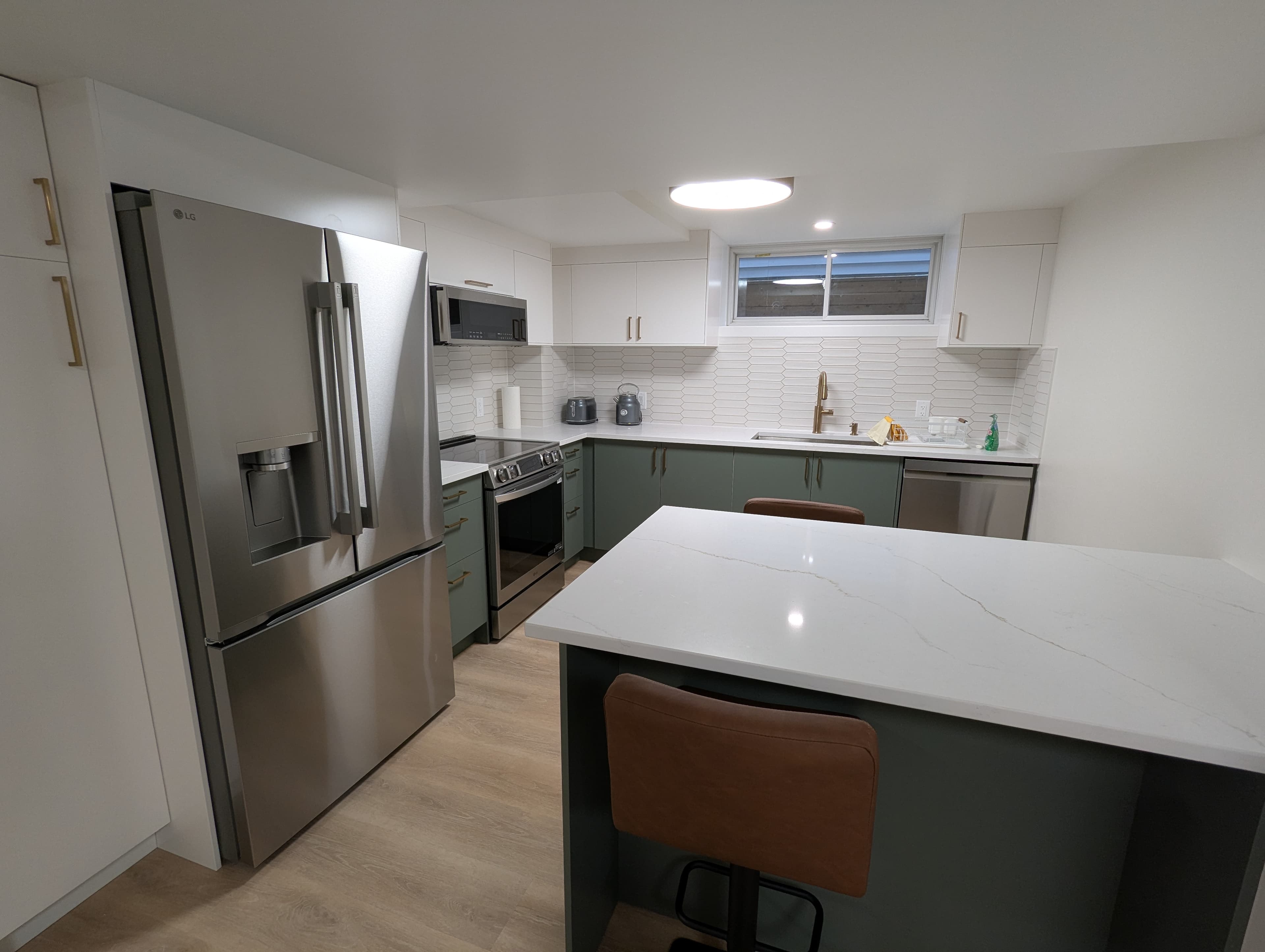 Kitchen with island and stainless steel appliances