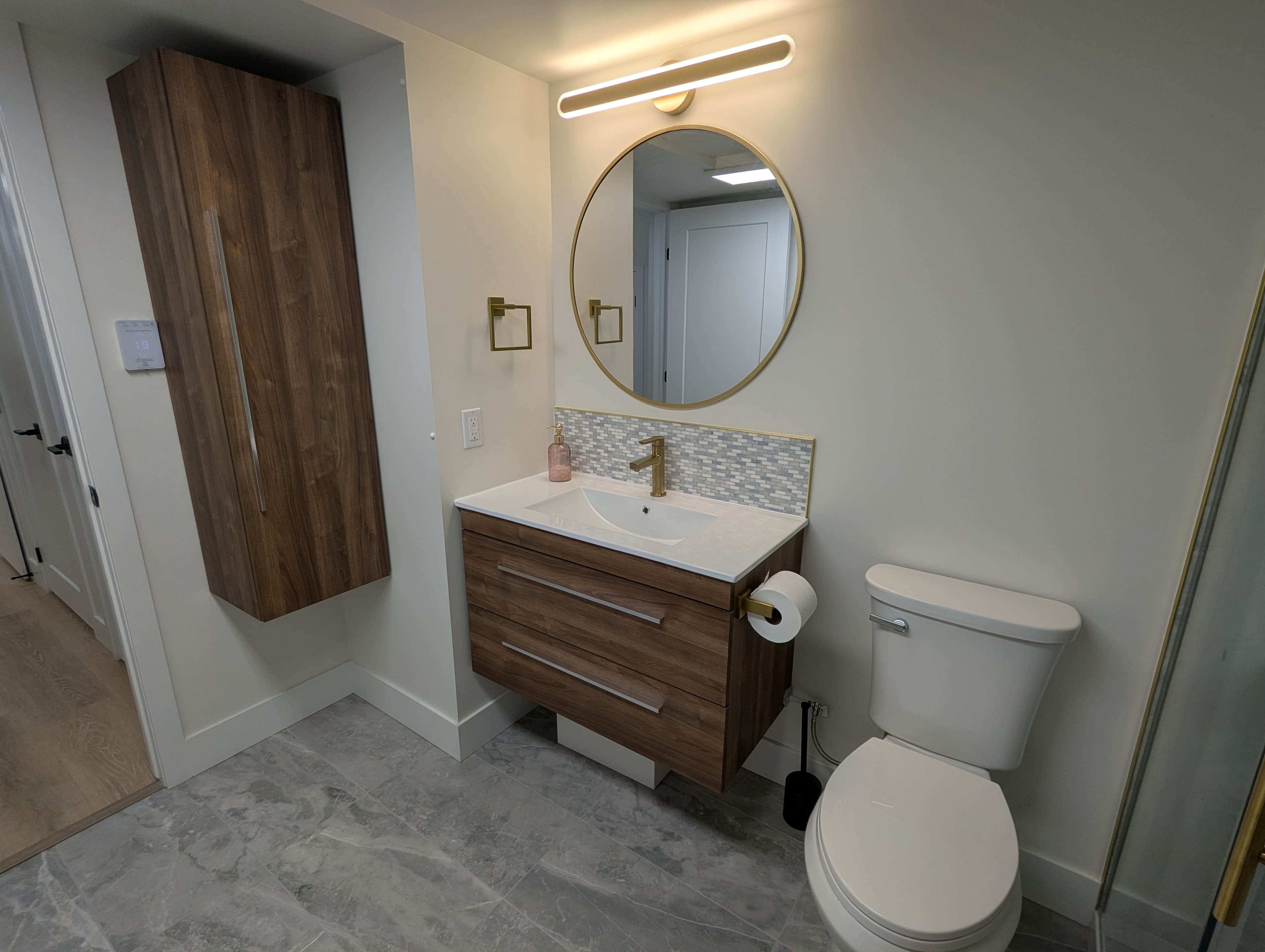 Bathroom vanity with round mirror